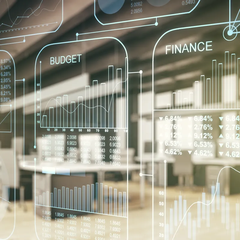 Transparente Finanzgrafiken vor moderner Büroumgebung.